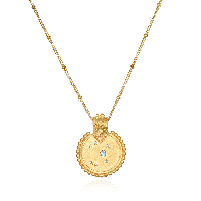 Mandala Zodiac Sagittarius Blue Topaz Necklace featuring a vibrant gold pendant, embodying spiritual jewelry that enhances meditation and serves as a talisman for protection and meaningful manifestation, ideal for yoga enthusiasts.
