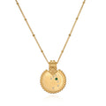 The Mandala Zodiac Taurus Emerald Necklace displayed elegantly, featuring the emerald stone and crafted in 18kt gold plate. This spiritual jewelry captures the essence of Taurus, making it a perfect meditation gift and a meaningful amulet for manifestation with protective and sacred qualities.