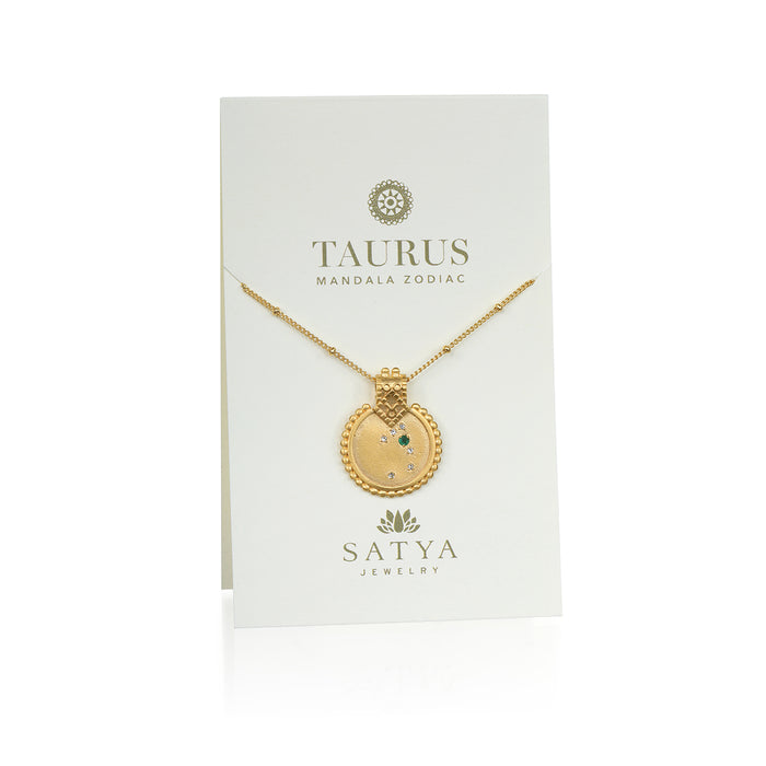 The Mandala Zodiac Taurus Emerald Necklace presented on a stylish card by Satya Jewelry, emphasizing its zodiac significance. This piece serves as a sacred talisman for Taurus, making it a perfect thoughtful gift for those seeking spiritual jewelry rich in meaning and protection.