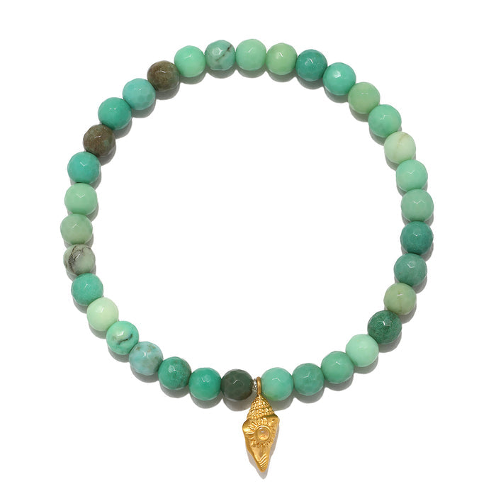 Stretch bracelet with green agate beads and gold-tone conch shell charm pendant.