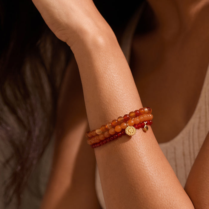 Close-up of the Manifest Protection Gemstone Bracelet Set worn elegantly on a woman's wrist, highlighting its unique gemstones and intricate design. This spiritual jewelry symbolizes inner peace and acts as a meditation talisman, making it a meaningful accessory for yoga and manifestation practices.