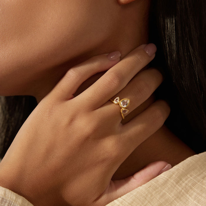 Close-up of a hand elegantly wearing the Manifesting Dreams White Topaz Petal Ring, symbolizing clarity and intuition, perfect for meditation practices and as a spiritual talisman for personal transformation and zodiac connections.