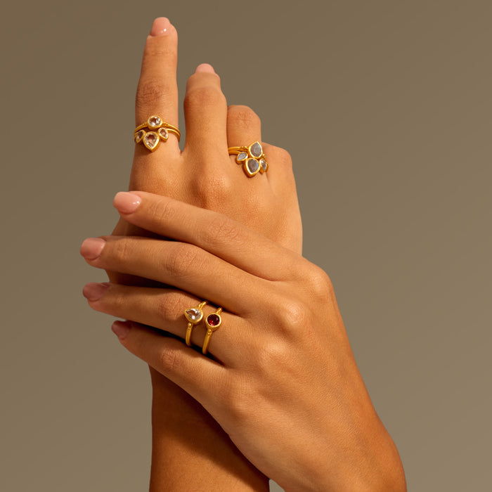 Multiple Manifesting Dreams White Topaz Petal Rings displayed on hands, illustrating diverse styles of spiritual jewelry that inspire meaningful connections, perfect for meditation and manifestation, enhancing your yoga journey.