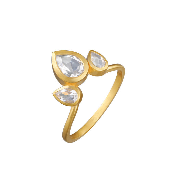An isolated shot of the Manifesting Dreams White Topaz Petal Ring, featuring sparkling white topaz stones, symbolizing clarity and intuition within the realm of spiritual jewelry, meditation, and the significance of meaningful manifestation.