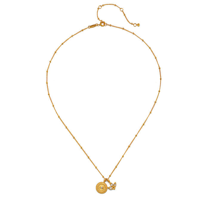 Flat lay of the Manifesting Possibilities Lotus White Topaz Necklace, emphasizing its intricate design and gold plating. This necklace serves as a meaningful charm that harmonizes with yoga and spiritual practices, embodying the themes of new beginnings and manifestation.