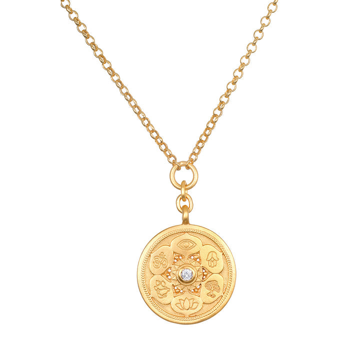 Gold-toned chain necklace with circular pendant featuring religious symbols and center crystal stone.