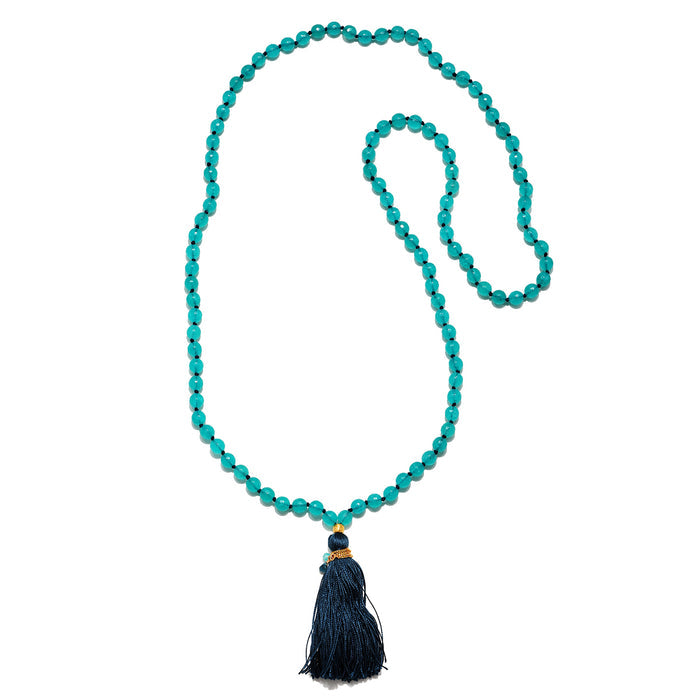 The Many Truths Angelite and Blue Topaz Gemstone Mala displayed elegantly, showcasing a long necklace design. This spiritual jewelry is perfect for mantra practice, embodying themes of protection, meaning, and personal growth.