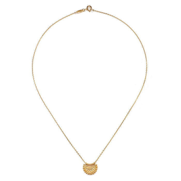 The Mini Mandala Necklace elegantly laid out on a white background, highlighting its 18kt gold plating and intricate design. This piece is perfect for those who appreciate spiritual jewelry, serving as a symbol of manifestation and sacred meaning in their lives.