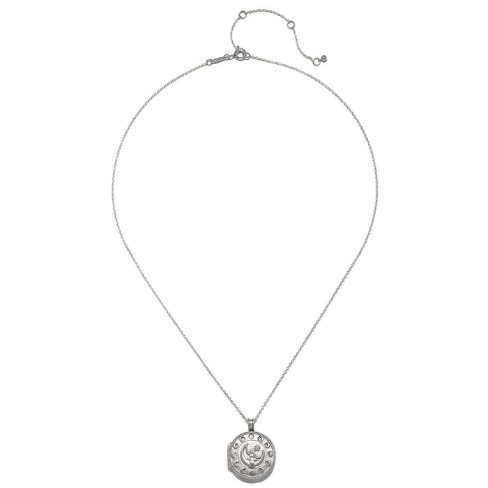 The Mother Moon Silver Locket Necklace displayed on a flat surface, highlighting its intricate design. This spiritual jewelry piece embodies the power of the moon and serves as a meaningful charm for meditation, protection, and nurturing one’s zodiac essence.