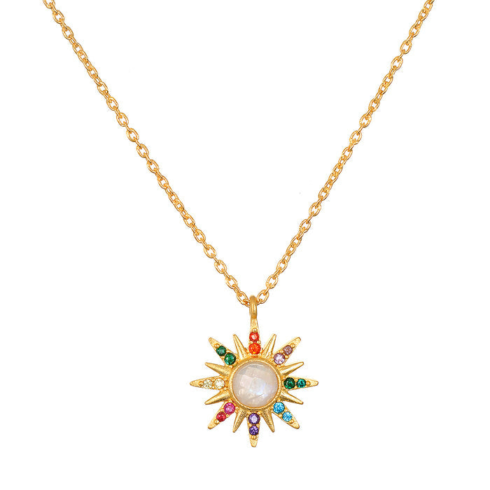 Gold chain necklace with starburst pendant featuring white moonstone center surrounded by multicolored crystals.