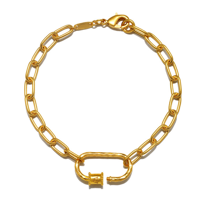 Elegant New Beginnings Lotus Charm Holder Bracelet in gold, featuring an engraved lotus flower, perfect for the yoga lover seeking meaningful spiritual jewelry for personal manifestation.