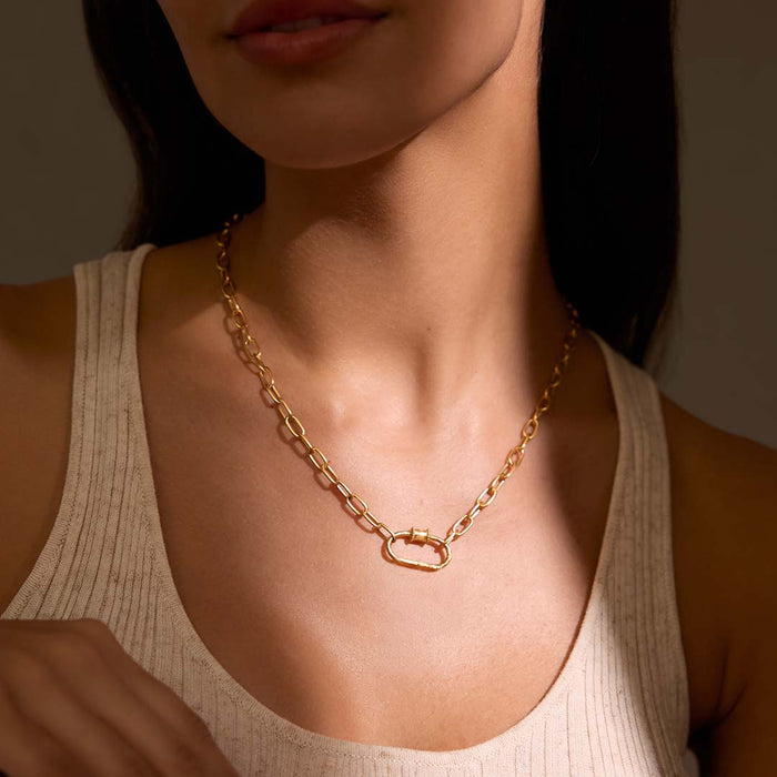 A stylish shot of the New Beginnings Lotus Charm Holder Necklace on a model, accentuating its charm holder feature. This meaningful piece of spiritual jewelry is designed for those seeking a personal talisman that embodies renewal and protection.