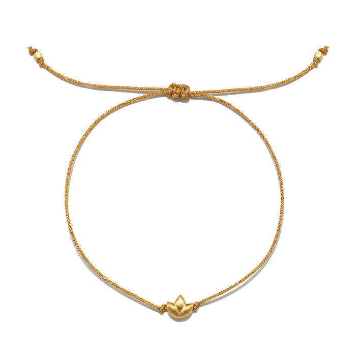 Gold-toned lotus charm pendant on tan cord bracelet with adjustable sliding knot closure.