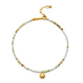 New Dawn Peruvian Opal Anklet featuring a delicate design with shaded green Peruvian opals, symbolizing tranquility and healing, complemented by a gold-plated sun pendant, embodying spiritual jewelry for protection and manifestation during meditation and yoga.