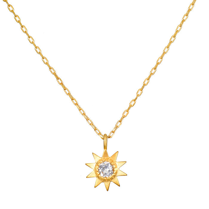 Gold-tone chain necklace with star-shaped pendant featuring a clear faceted stone in the center.