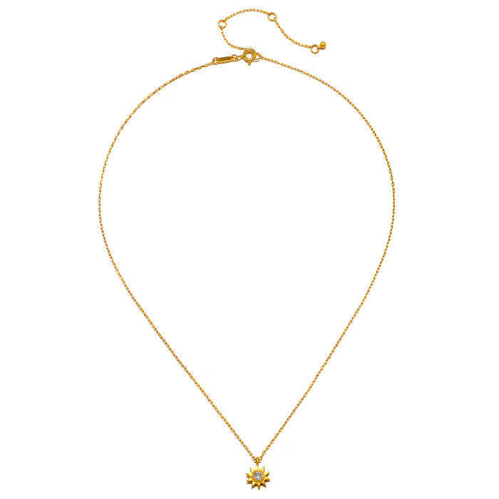 Gold-tone chain necklace with small star-shaped pendant set with clear white stones.
