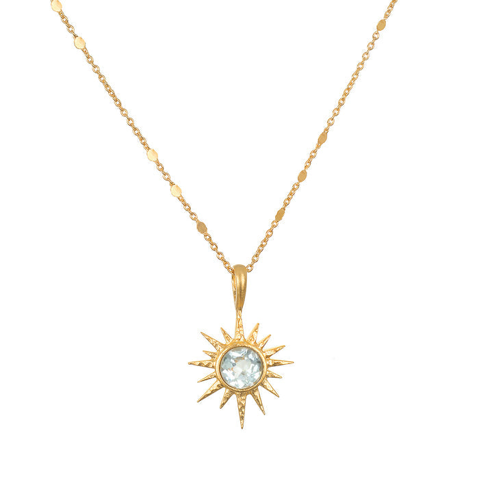 North Star Blue Topaz Starburst Necklace featuring a luminous blue topaz set in an 18kt gold plated starburst, perfect for spiritual jewelry and meditation, symbolizing protection and meaningful manifestation.