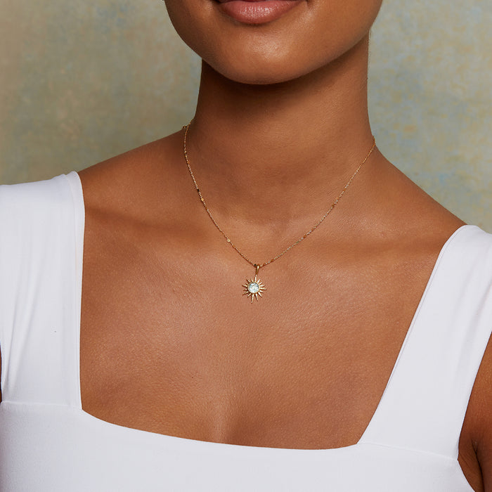 Model wearing the North Star Blue Topaz Starburst Necklace, showcasing its elegant design that combines beauty and meaning in spiritual jewelry, ideal for zodiac enthusiasts and yoga practitioners.