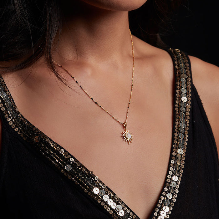 Model wearing the North Star Moonstone Starburst Necklace, showcasing its beauty and significance in spiritual jewelry. This piece symbolizes guidance and charm for meditation and zodiac practices, ideal for anyone seeking meaningful adornment.