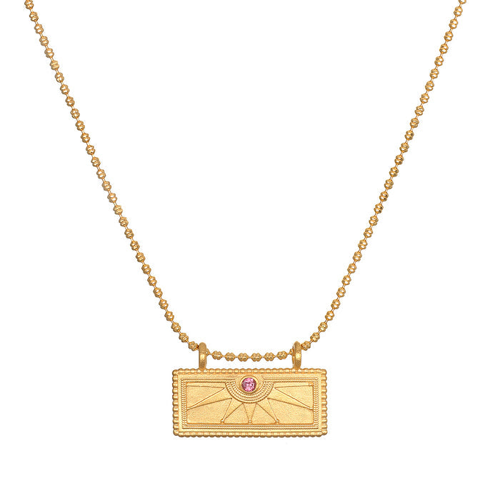 October Pink Tourmaline Sunburst Birthstone Tablet Necklace featuring an engraved sunburst design and accented with a pink tourmaline stone. This spiritual jewelry symbolizes vitality, protection, and meaningful manifestation, perfect for meditation and yoga enthusiasts.