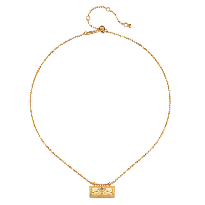The October Pink Tourmaline Sunburst Birthstone Tablet Necklace displayed elegantly, showcasing its design with a 16-inch chain and 3-inch extension. A beautiful addition to spiritual jewelry collections, this necklace represents abundance, peace, and manifestation.