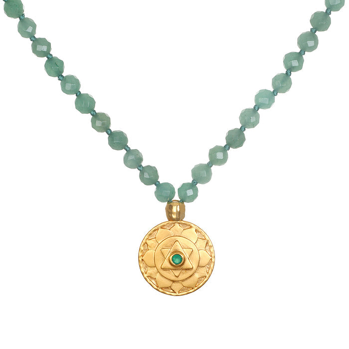 The Open to Love Chakra Mala features 108 green aventurine beads, a symbol of the heart chakra, complemented by a stunning 18kt gold plated pendant. Perfect for spiritual jewelry, meditation, and yoga practices, this mala serves as a meaningful talisman for protection and manifestation.