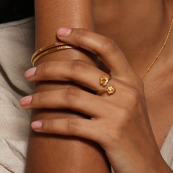 Open to Possibilities Double Lotus Ring showcased on a model's hand, highlighting its intricate lotus flower design. This piece embodies spiritual jewelry ideal for meditation and manifestation, serving as a meaningful charm that resonates with the essence of new beginnings, protection, and personal growth.