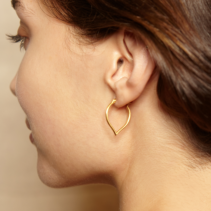 Close-up of a model wearing Open to Possibilities Earrings, showcasing their elegant design. These spiritual jewelry pieces symbolize higher consciousness and connectivity, perfect as meditation gifts for those interested in yoga and meaningful practices.