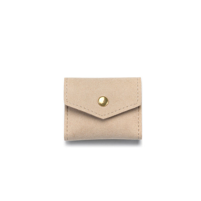 Overnight Journey Travel Jewelry Wrap featuring soft tan microfiber material, perfect for keeping your spiritual jewelry secure. Ideal for meditation and carrying meaningful talismans, zodiac malas, and other pieces for protection while traveling.