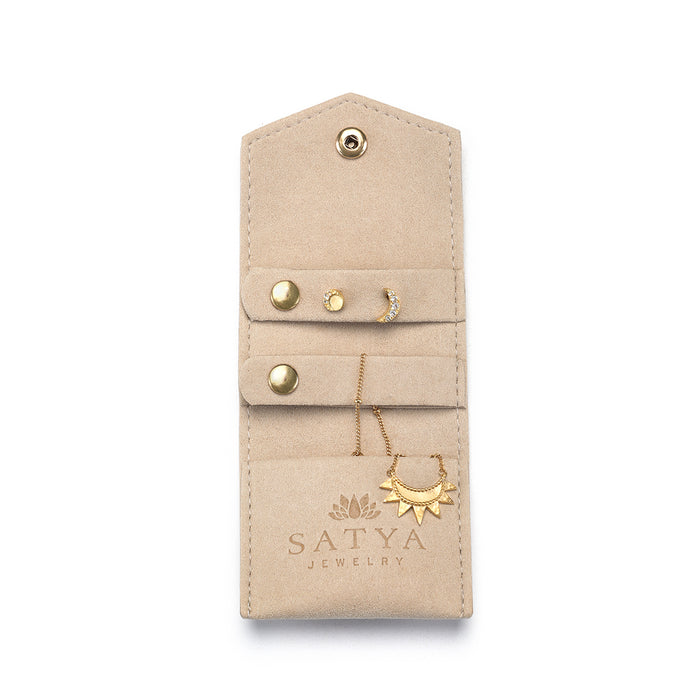 Interior view of the Overnight Journey Travel Jewelry Wrap showcasing organized sections for earrings and necklaces, designed to protect valuable spiritual jewelry such as talismans and zodiac symbols, enhancing your yoga and meditation journey.