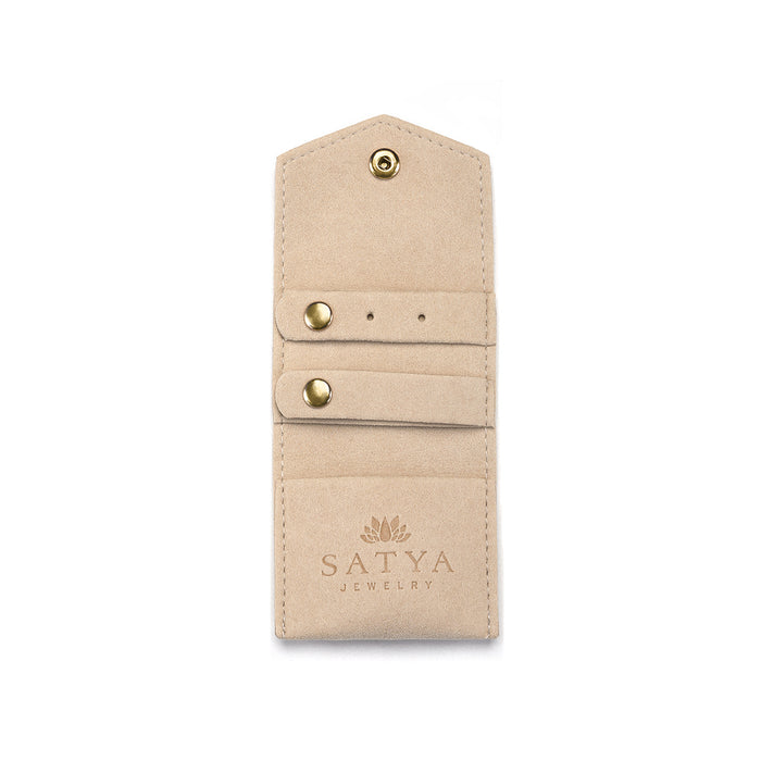 Another angle of the Overnight Journey Travel Jewelry Wrap highlighting its stylish tan microfiber design, perfect for manifesting your favorite spiritual jewelry and ensuring the safe travel of your meaningful pieces like sun and moon-inspired talismans.