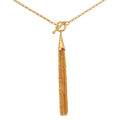 Gold-tone chain necklace with toggle clasp and elongated tassel pendant.