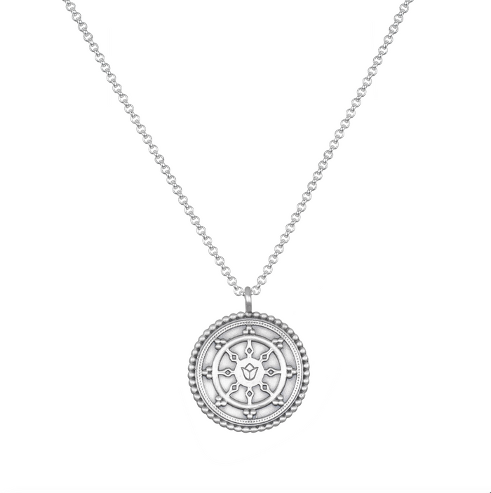 Pathway to Love Necklace in silver with a Tibetan Wheel of Life pendant. This meaningful spiritual jewelry serves as a talisman, ideal for meditation and yoga, embracing protection and a connection to zodiac energies and the essence of manifestation.