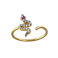Gold-toned snake-shaped ring with clear and pink rhinestones, adjustable open band design.