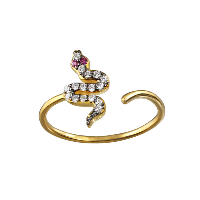 Gold-toned snake-shaped ring with clear and pink rhinestones, adjustable open band design.