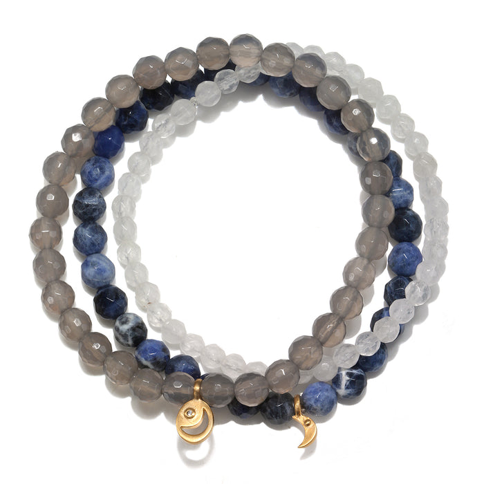 Peace & Protection Moon Gemstone Bracelet Set showcasing a trio of white jade, grey agate, and sodalite beads. This spiritual jewelry promotes inner peace, creativity, and joy, making it a perfect gift for meditation and yoga practices. Each bead symbolizes protection and meaningful connections, ideal for those seeking manifestations and amulets to enhance their sacred journey.