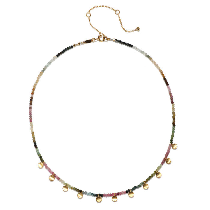 Close-up of the Peace & Protection Tourmaline Choker, highlighting its colorful tourmaline beads and 18k gold charms. This protective jewelry serves as a symbolic amulet for manifestation, connecting to zodiac energies and enhancing spirituality.
