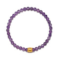 Purple amethyst beaded stretch bracelet with gold-tone cube spacer bead.