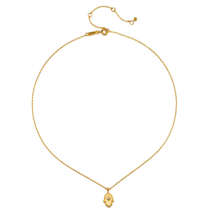 The Protective Hand White Topaz Hamsa Necklace displayed elegantly, highlighting its design features that symbolize protection and manifestation, perfect for those interested in spiritual jewelry.