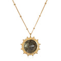Pursue Your Truth Labradorite Necklace featuring a stunning labradorite pendant set in 18k gold plate. This piece of spiritual jewelry symbolizes imagination, perseverance, and truth, making it perfect for meditation gifts or as a protective amulet for yoga enthusiasts. Its meaningful design encourages manifestation and connects with zodiac energies, offering a sacred touch to any outfit.
