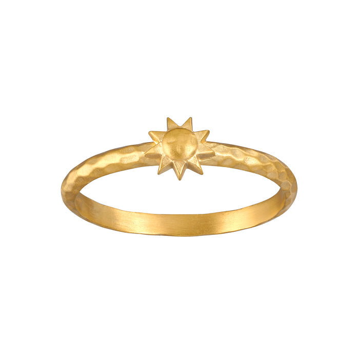 Gold band ring with a star-shaped ornament on top.