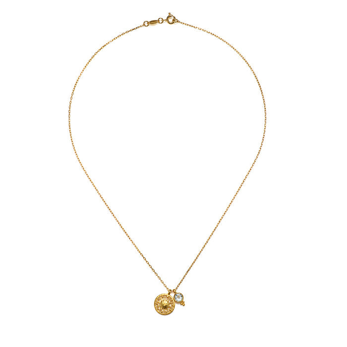 Close-up of the Radiate Love Sun Necklace, depicting the sun and blue topaz, a symbol of wisdom and protection, perfect for those interested in zodiac and spiritual meaning.