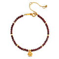 Red Garnet Lotus January Birthstone Bracelet, a stunning piece of spiritual jewelry featuring red garnet beads, symbolizing grounding and love, adorned with an 18kt gold plated lotus flower. This meditation talisman embodies transformation and renewal, perfect for those interested in zodiac meanings. Ideal for yoga enthusiasts and anyone seeking meaningful manifestation and protection in their life.