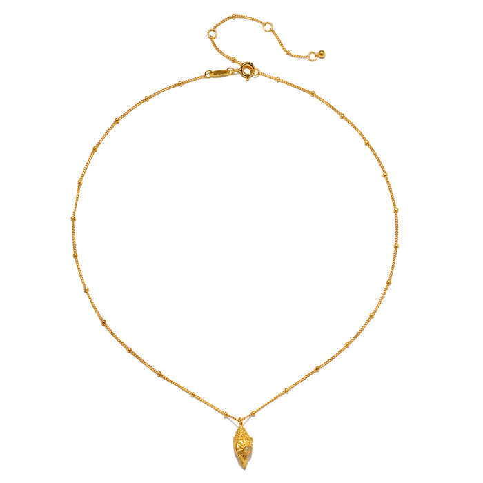 Gold-toned chain necklace with small beaded spacers and a textured conch shell pendant.