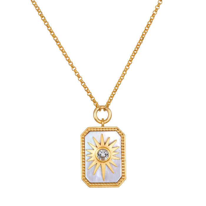 Gold chain necklace with rectangular mother of pearl pendant featuring a gold sun design and center crystal.