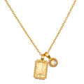 Gold-tone necklace with rectangular pendant featuring radiating lines and small stone, paired with round moonstone charm on c