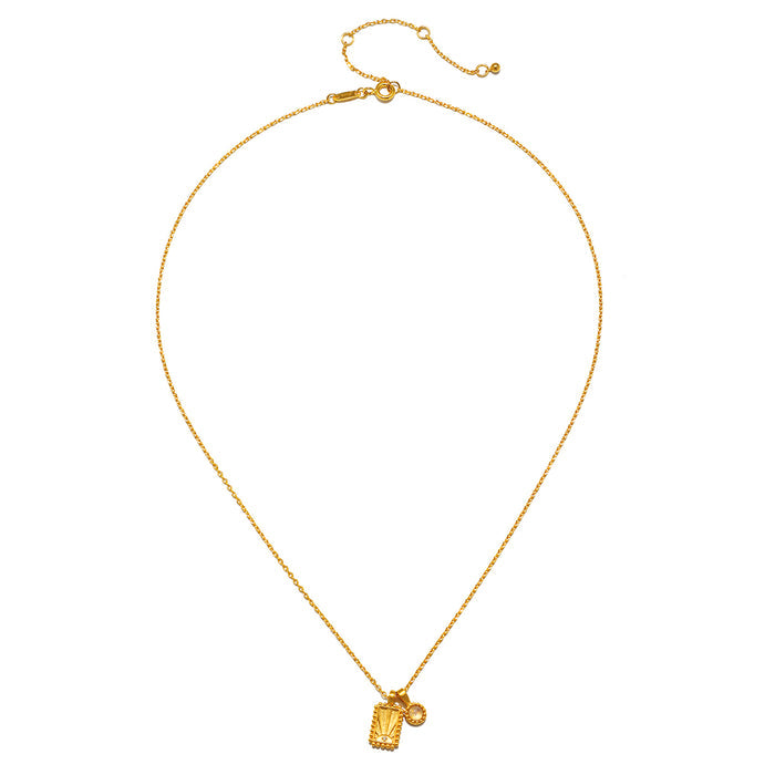 Gold chain necklace with rectangular moonstone bezel pendant and adjustable clasp.