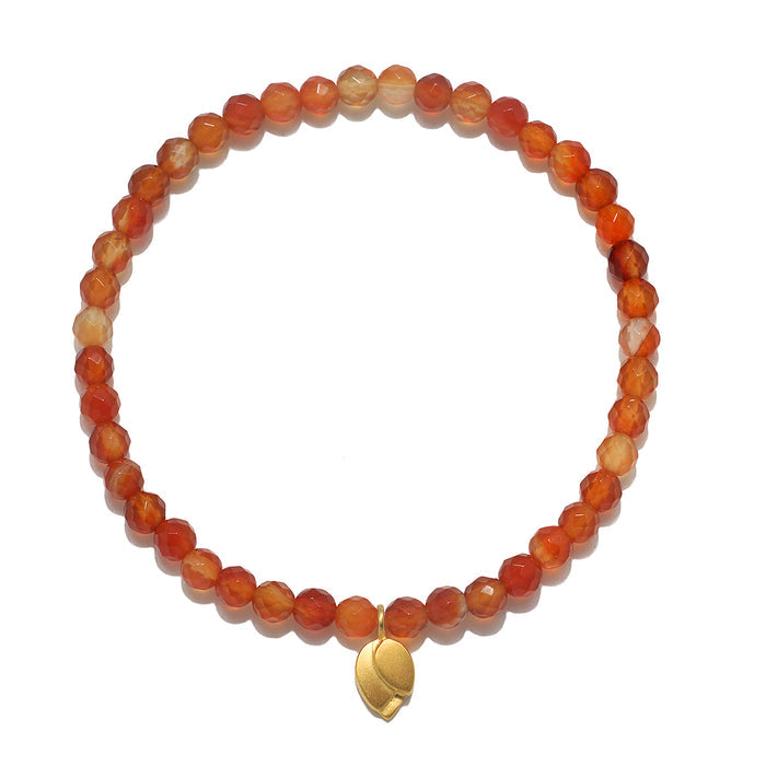 Rooted in Strength Lotus Carnelian Gemstone Bracelet featuring orange carnelian beads and a golden lotus leaf pendant, perfect for spiritual jewelry, meditation, and use in yoga practices for protection and manifestation.