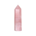 Rose Quartz Altar Crystal displayed prominently, showcasing its beautiful pink hue and natural texture. This gemstone is perfect for enhancing spiritual practices and is ideal for meditation, manifesting love and compassion, and is often used in spiritual jewelry, protection talismans, and alongside zodiac malas. Perfect for yoga and meaningful spiritual rituals.