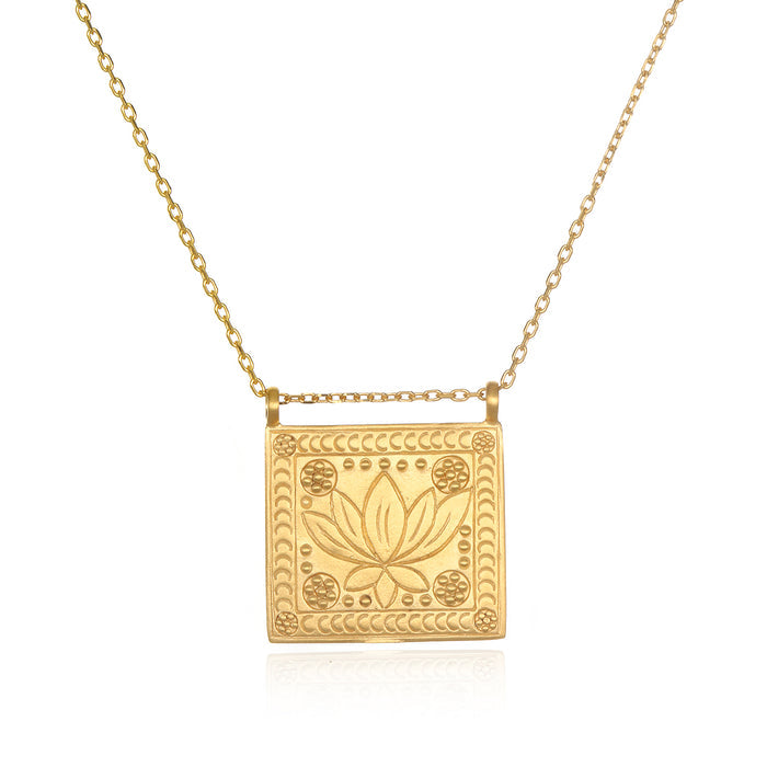 Sacred Commencement Lotus Necklace featuring a gleaming square pendant with an engraved lotus flower symbolizing new beginnings and full potential. This spiritual jewelry piece serves as a talisman for meditation and manifestation, perfect for yoga enthusiasts and those seeking meaningful protection from the universe.